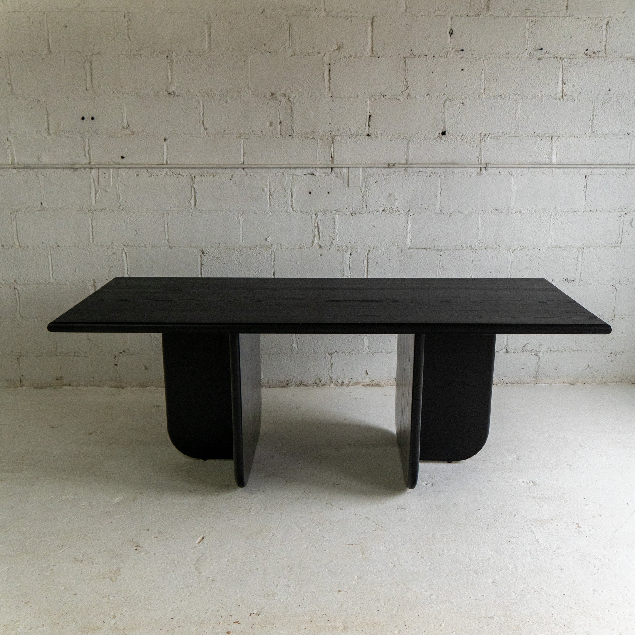 black lacquer dining table front view