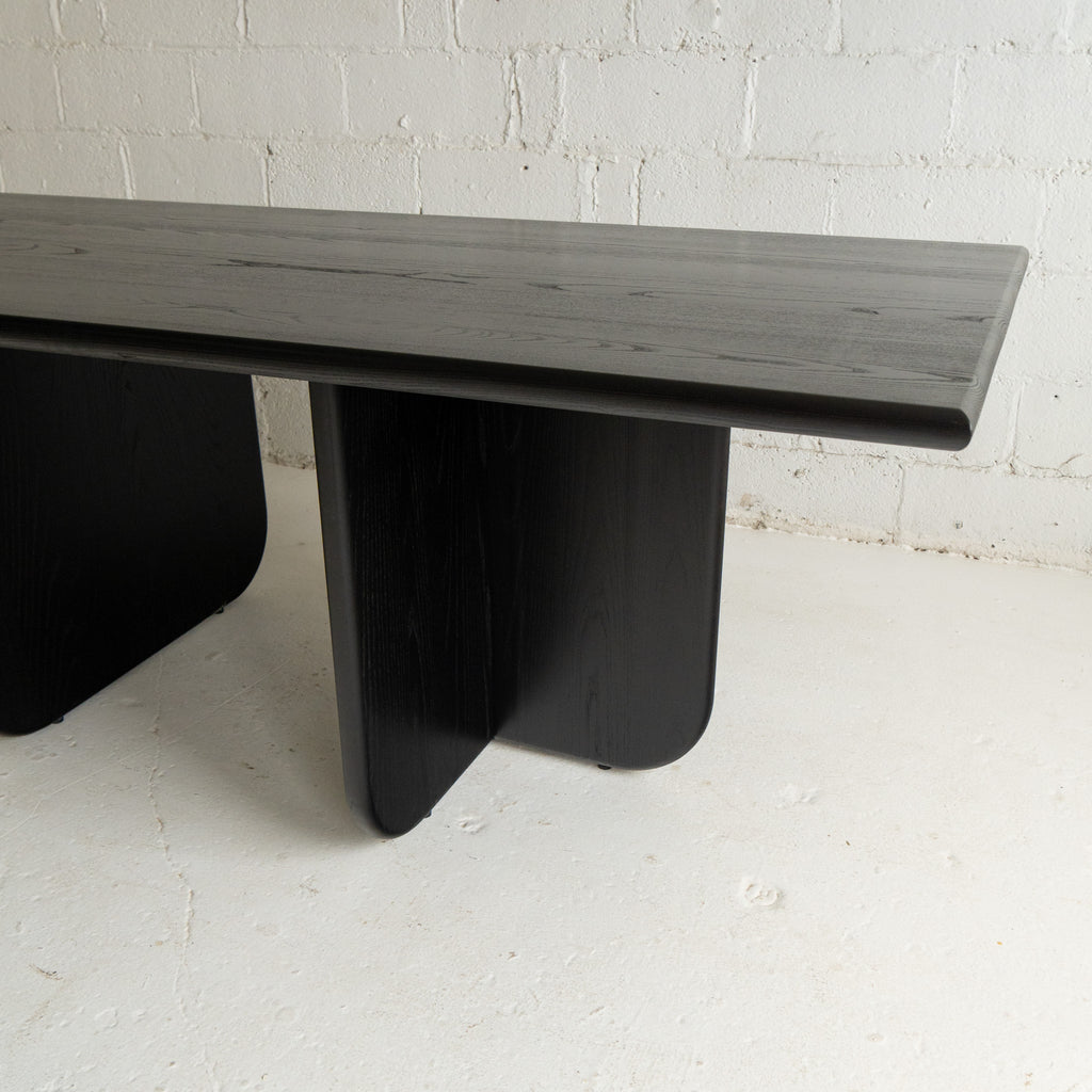 black lacquer dining table rounded edges view