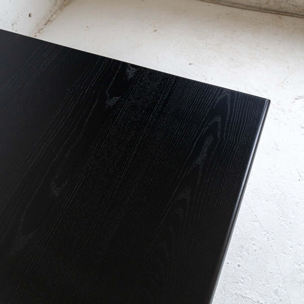 black lacquer dining table rounded corner view